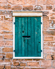 Old storm shutter in the Spanish quarter of old Saint Augustine Florida