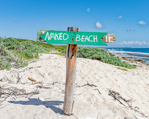 Naked beach sign