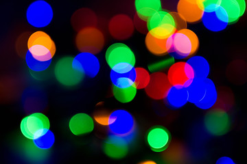 Christmas lights on black background, abstract for text, advert