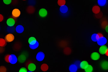 Christmas lights on black background, abstract for text, advert