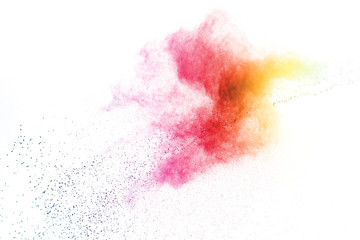 Freeze motion of colorful color powder exploding on white background.  Paint Holi.