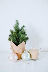 Christmas decoration - little Christamas tree, lights and ball on white background. Modern Card style 