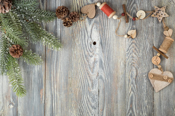 Stylish flat lay with Eco friendly toys decorated by pine tree branches for Christmas or New Year