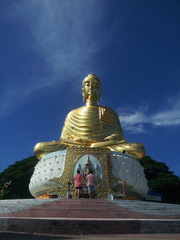 People are paying homage to buddha image.