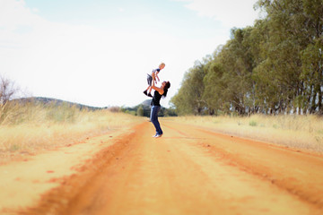 Mother and son mucking around on country road in Central Victoria, Australia