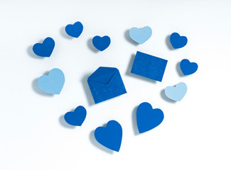 Heart shape made of paper hearts on white paper background. Valentine's day concept