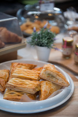 Various flavors pies placed on a white tray