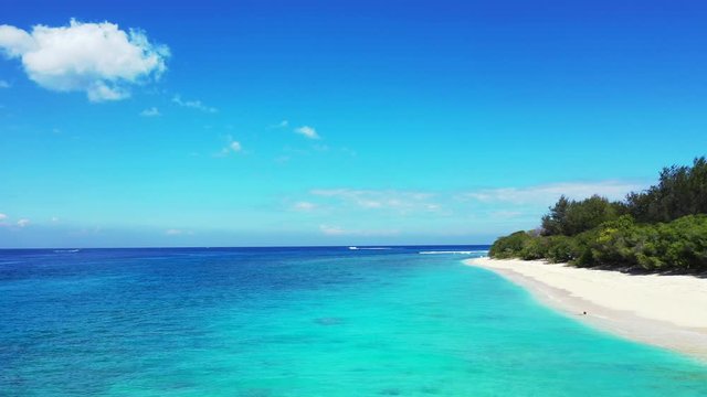 Hanimaadhoo Island, Maldives - Famous Tropical Island With White Sand and Green Trees Surrounded By Deep Blue Ocean - Wide Shot