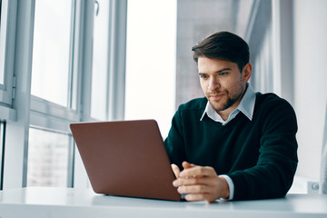 Fototapeta premium businessman working on laptop in office