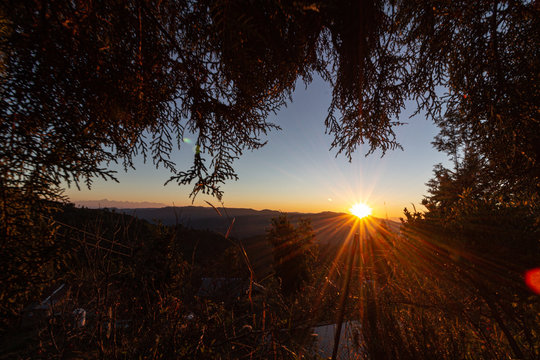 Sunburst in mukteshwar with annapurna ranges on the left.