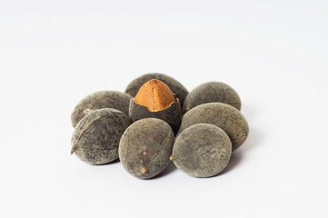 Fototapeta premium Velvet tamarind fruit ( Dialium cochinchinense) or buah keranji isolated on white background.