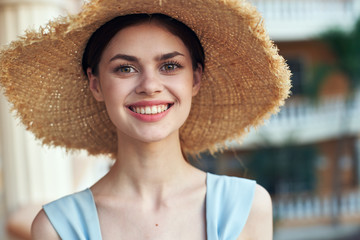 portrait of young woman in straw hat