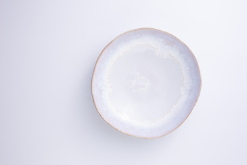 White ceramic plate isolated on white background.