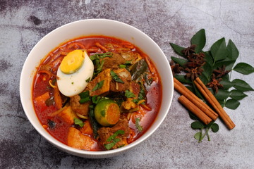Bowl of mutton curry noodle with Indian spices