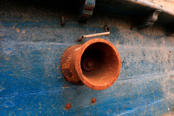 Oxide rusty metal parts on wooden fishing boats