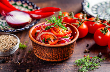Oriental cuisine concept. Uzbek tomato salad with onions. background image. copy space