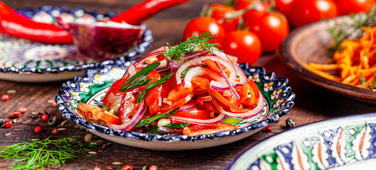 Oriental cuisine concept. Uzbek tomato salad with onions. background image. copy space