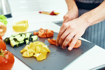 woman cutting vegetables in the kitchen