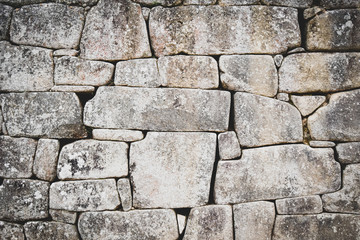 Detail of Inca wall into the lost city of Machu Picchu