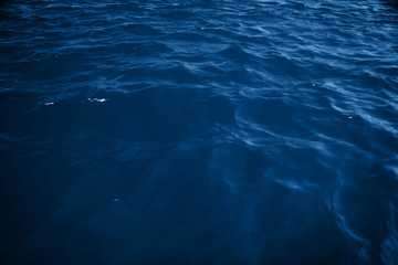 Surface ocean blue water background. Natural water paradise. Ocean nature depth and tranquility.