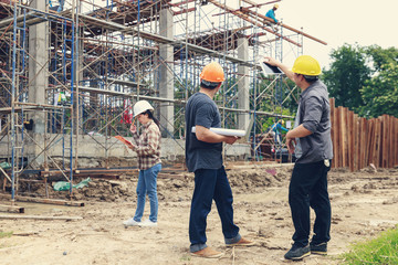 Plakat Construction concept of Engineer and Architect working at Construction Site with blue print