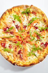 Pizza with Salmon, Cream Cheese and Fresh Rucola Leaves Isolated