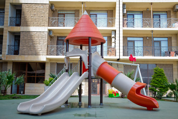 Children kids playground with play equipment outdoor. Kids playground with slides in the park. play...