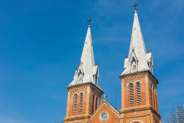 Obraz premium Notre Dame Cathedral with blue sky in Ho Chi Minh City, Vietnam