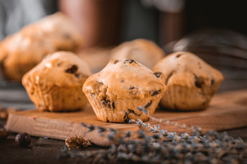Closeup of bran muffins with raisins on wooden background