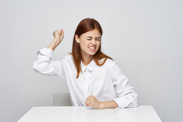 business woman sitting at desk with laptop