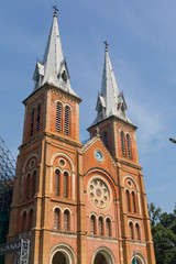 Fototapeta na wymiar Notre Dame Cathedral with blue sky in Ho Chi Minh City, Vietnam