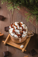 Glass cup of hot chocolate with marshmallows and chocolate