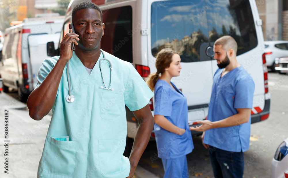 Wall mural ambulance team going to call with medical equipment