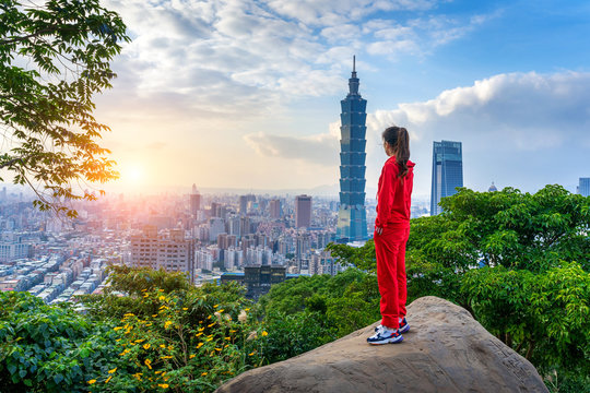 Tourist woman enjoying view on mountains in Taipei, Taiwan.