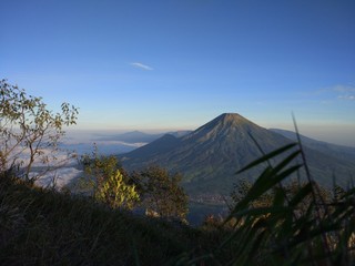 Obraz premium INDONESIA. AGUST 27, 2017. Camping trip tent on holiday, Adventures Camping tourism and tent with beautiful sunrise in place for camping at Mount Sumbing.