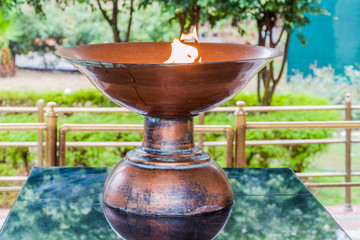 AMRITSAR, INDIA - JANUARY 26, 2017: Eternal flame at the Jallianwala Bagh massacre memorial in Amritsar, Punjab state, India
