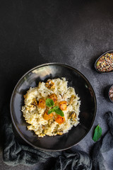 risotto mussels, pumpkin (main course, rice seafood) menu concept. food background. top view. copy space