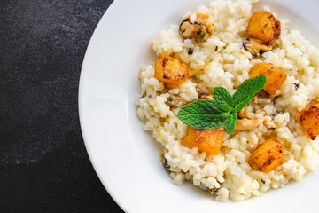 risotto mussels, pumpkin (main course, rice seafood) menu concept. food background. top view. copy space
