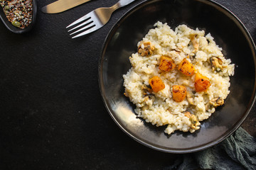 risotto mussels, pumpkin (main course, rice seafood) menu concept. food background. top view. copy space