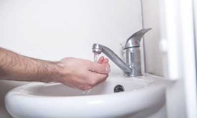 Man cleaning hands. Hygiene. Washing hands
