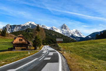 The snow capped "Admonter Kalbling" in the "Kaiserau" mountains near Admont, Styria, Austria with blue sky and light clouds