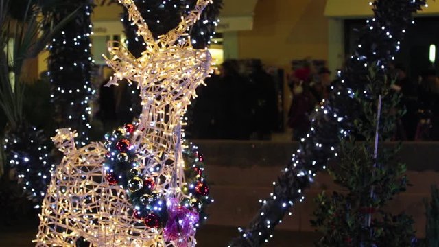 Christmas decorations and lights on the streets of the town of Salo on Lake Grada, Italy. Soft focus. Magic Nights.