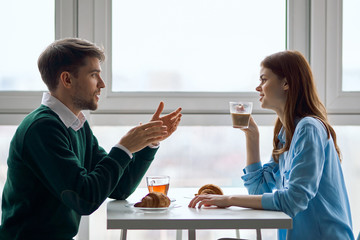 man and woman working together in office
