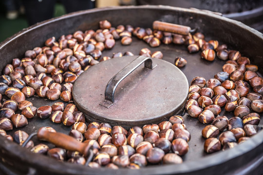 Roasted chestnuts in a frying pan somewhere in the street market