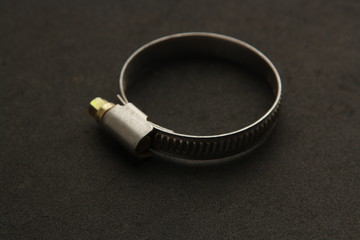 metal plumber clamp in color background