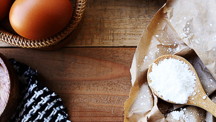 Bread and flour - Baking on wood background with egg and pastry flour