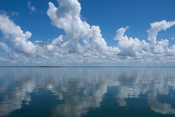 Nephology art. A beautiful sky cloudscape scene, with white Cumulonimbus cloud in a mid blue sky.