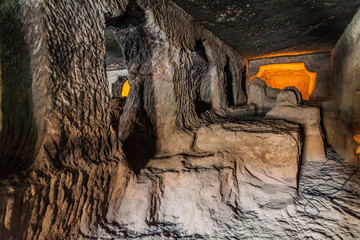 Unfinished monastery (vihara), cave 24, carved into a cliff in Ajanta, Maharasthra state, India