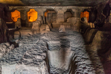 AJANTA, INDIA - FEBRUARY 6, 2017: Unfinished monastery (vihara), cave 24, carved into a cliff in...