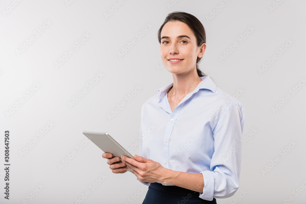 Poster young elegant businesswoman with touchpad surfing in the net in isolation